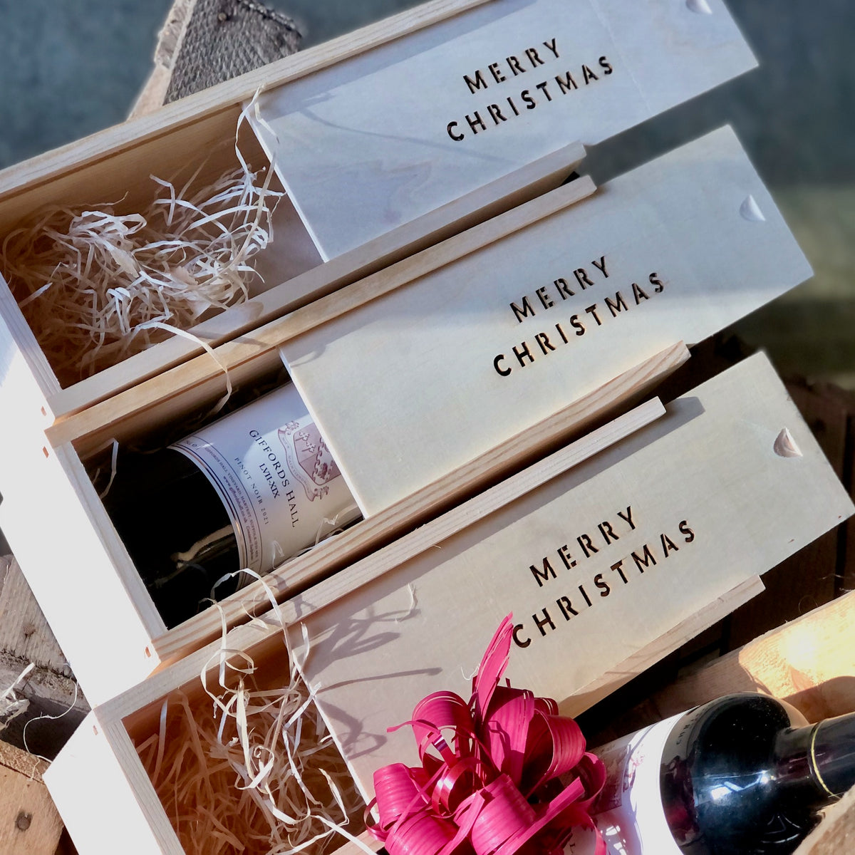 Merry Christmas box with a bottle of Giffords Hall wine